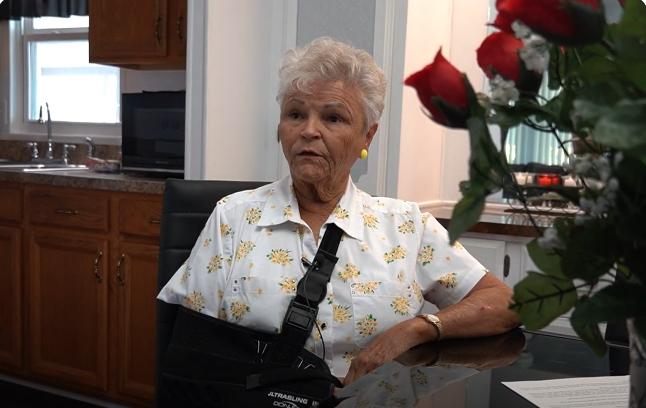 Coleen seated in her kitchen