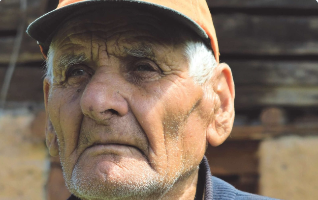 Close-up portrait of Dave wearing a cap